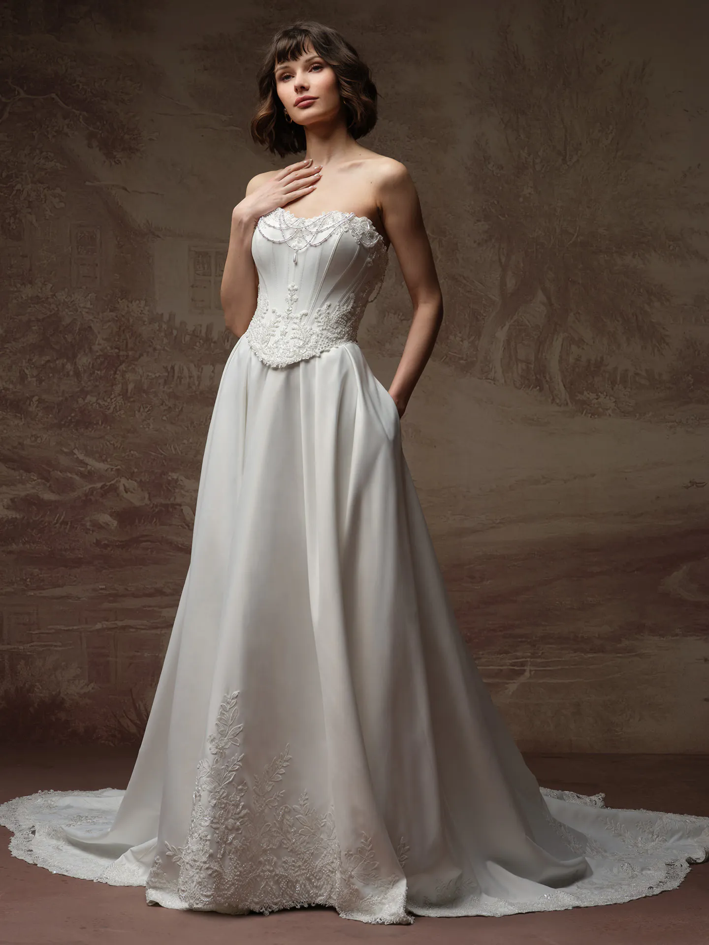 Maggie Sottero Seattle A Line wedding dress front view with pearl details.