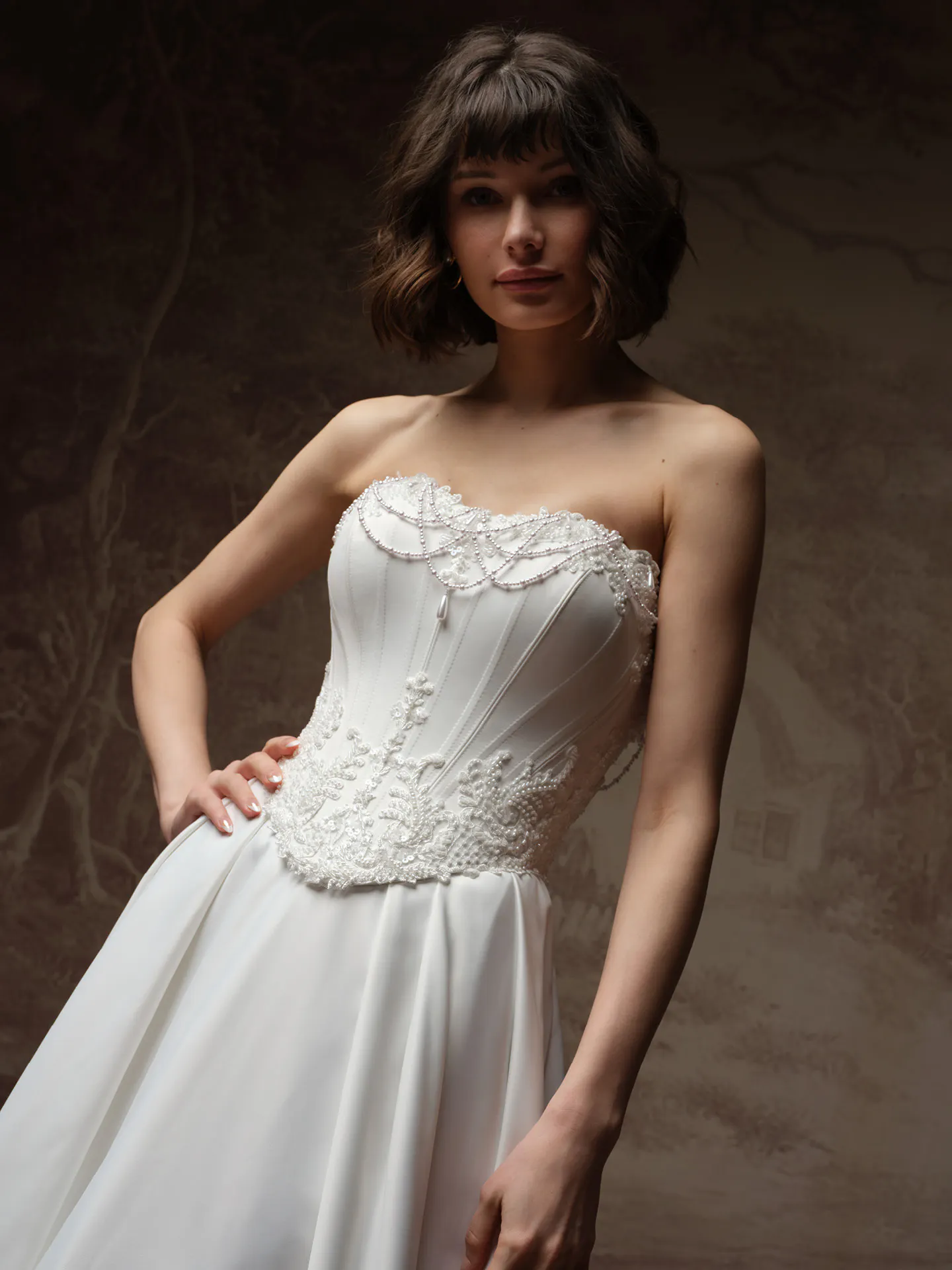 Maggie Sottero Seattle front view strapless satin A-line with pearl detail.