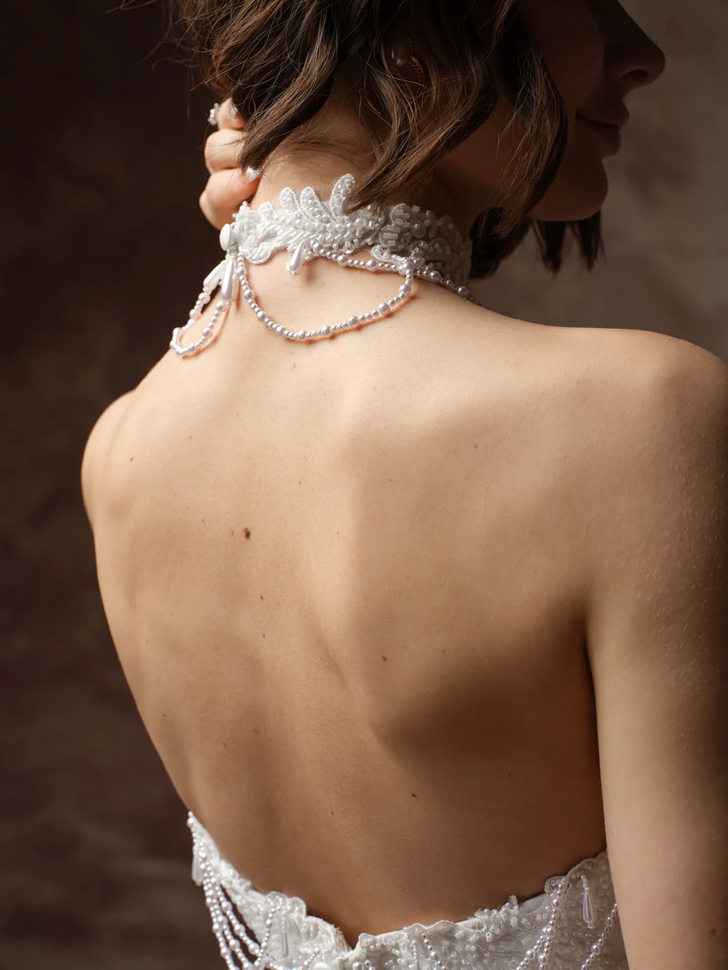 Seattle pearl detail satin A-line back view.