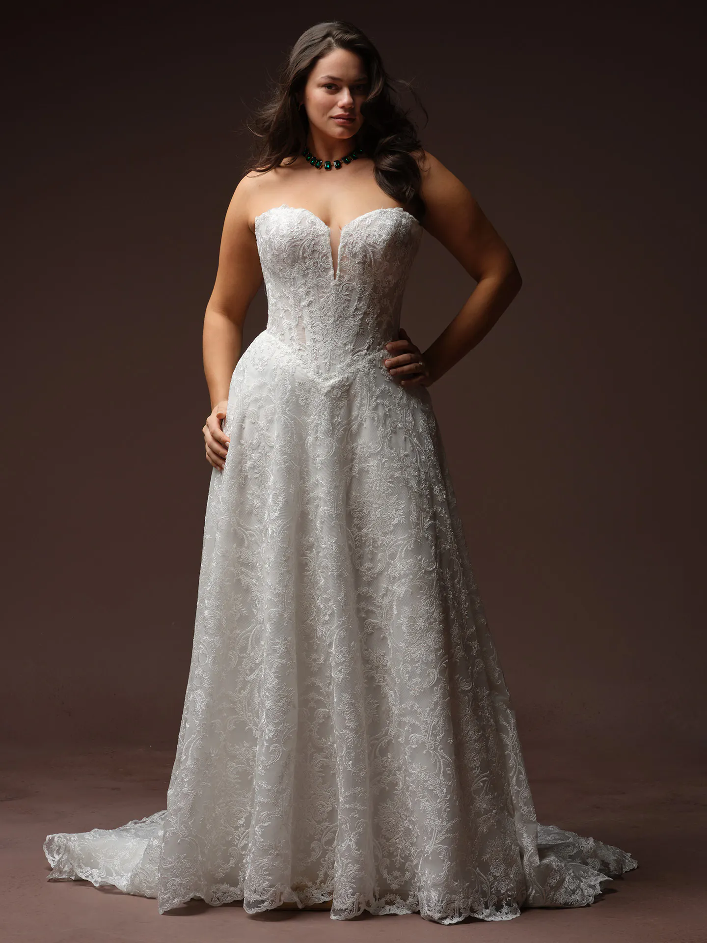 Zahia lace basque waist V-neck wedding dress front view Maggie Sottero.