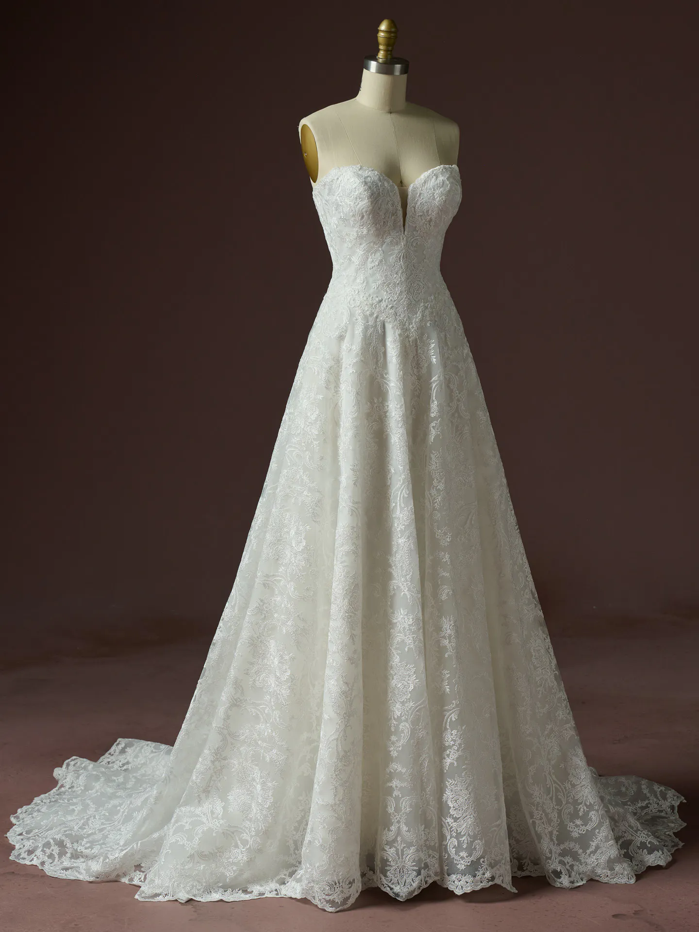 Zahia lace basque waist V-neck wedding dress front view Maggie Sottero.