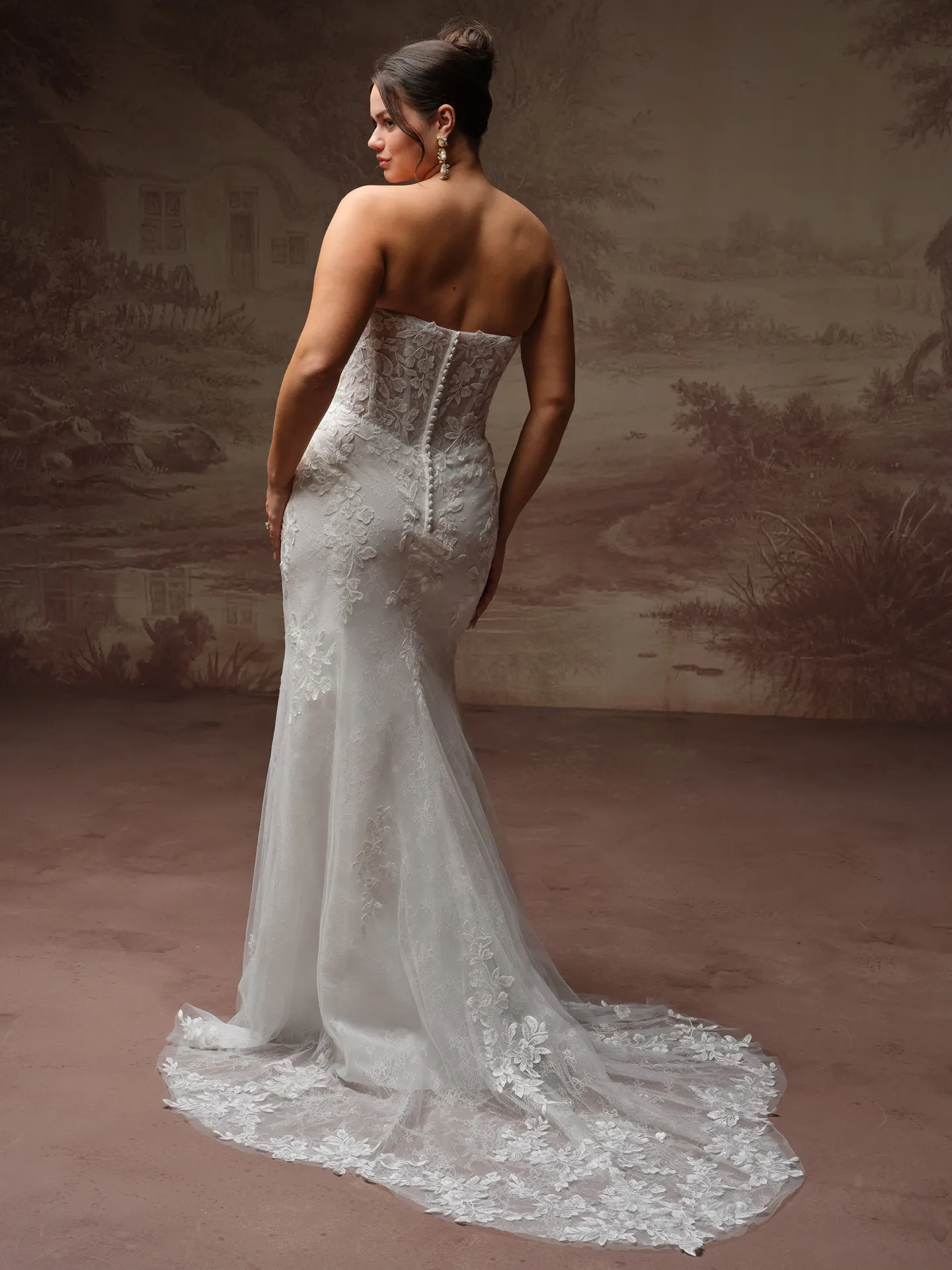 Rebecca Ingram Brandy fit-and-flare wedding dress back view with flowing skirt.