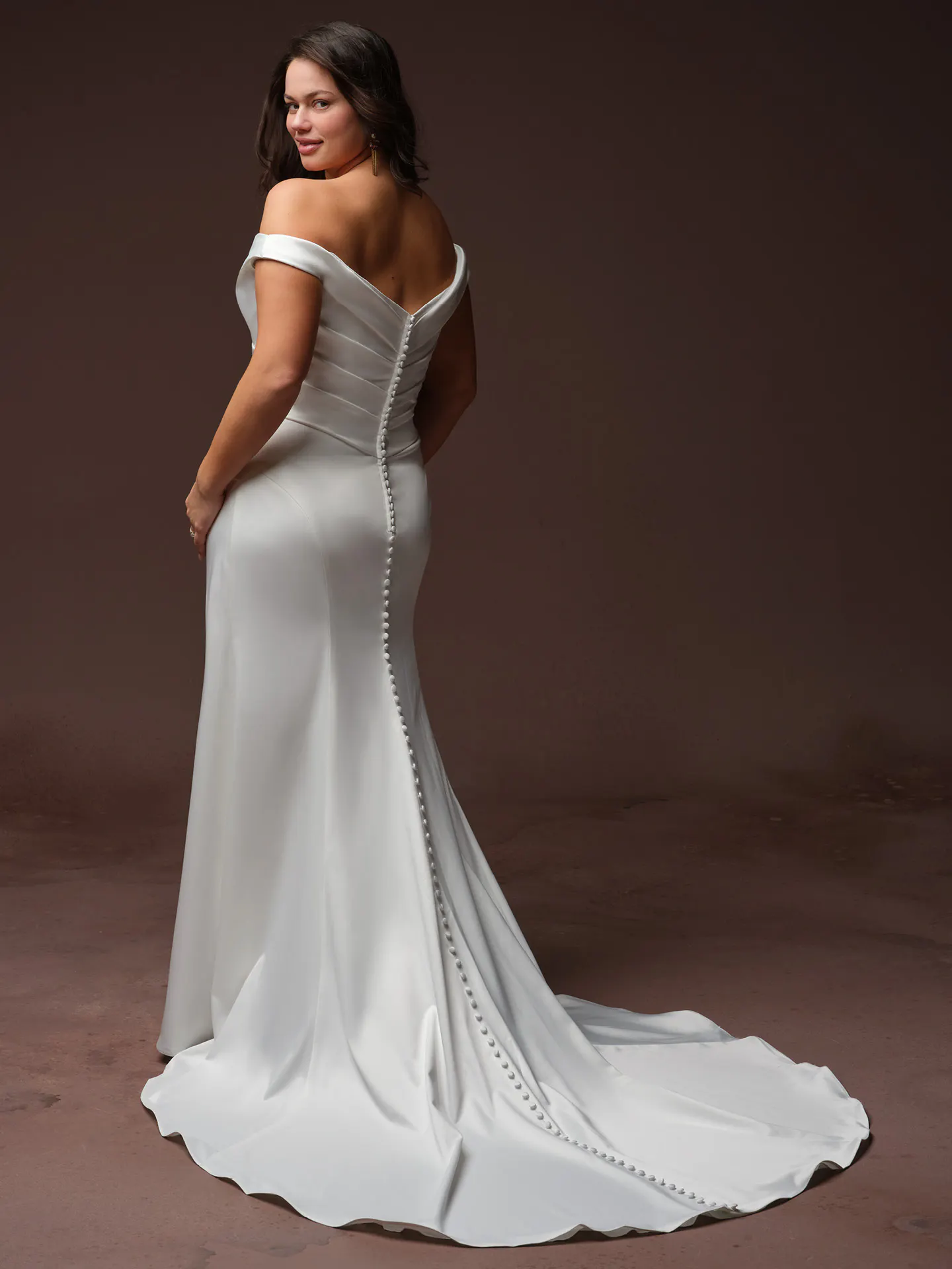 Rebecca Ingram Clementine, back view off-shoulder wedding dress with button detail.