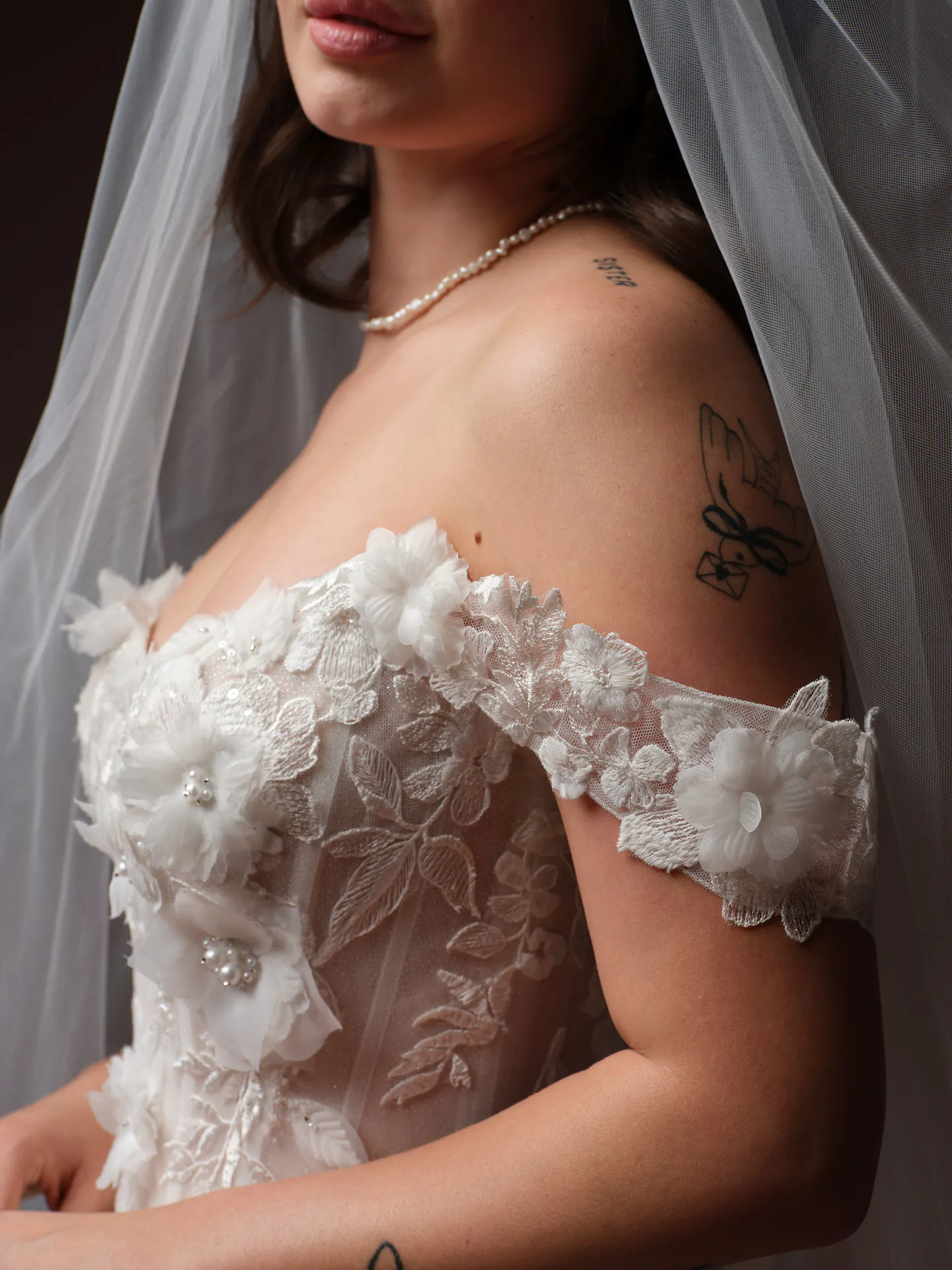 Rebecca Ingram Fleur, side view with 3D floral lace detailing.