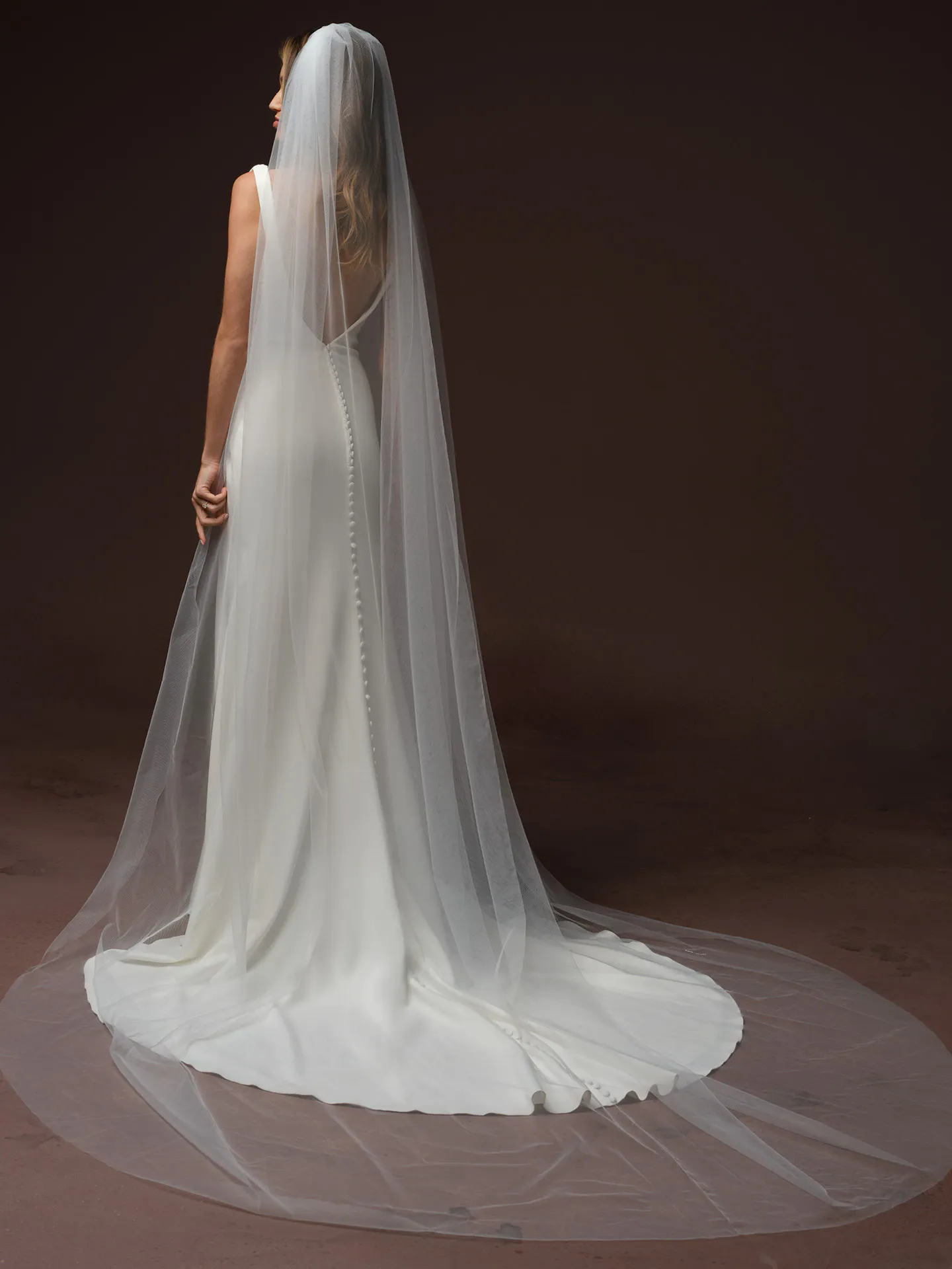 Rebecca Ingram Tiana satin fit-and-flare dress, back view with long veil.