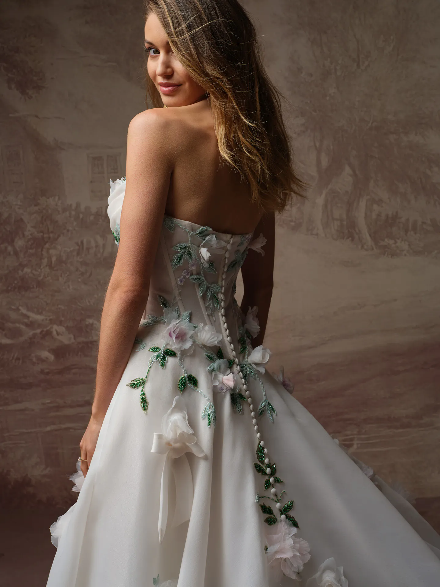 Sottero and Midgley Amaryllis back view with 3D floral designs and bows.