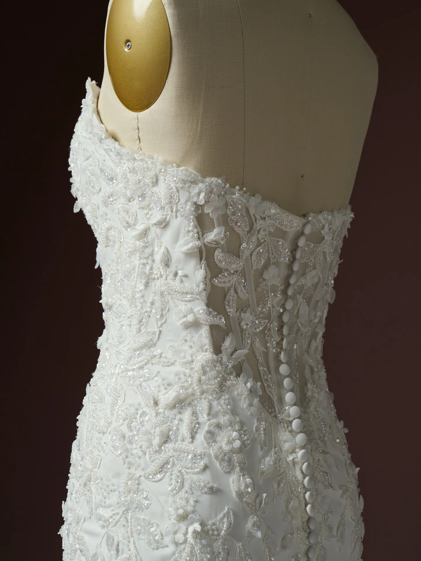 Sottero and Midgley Blair side view 3 D lace fit-and flare wedding dress with button detail.