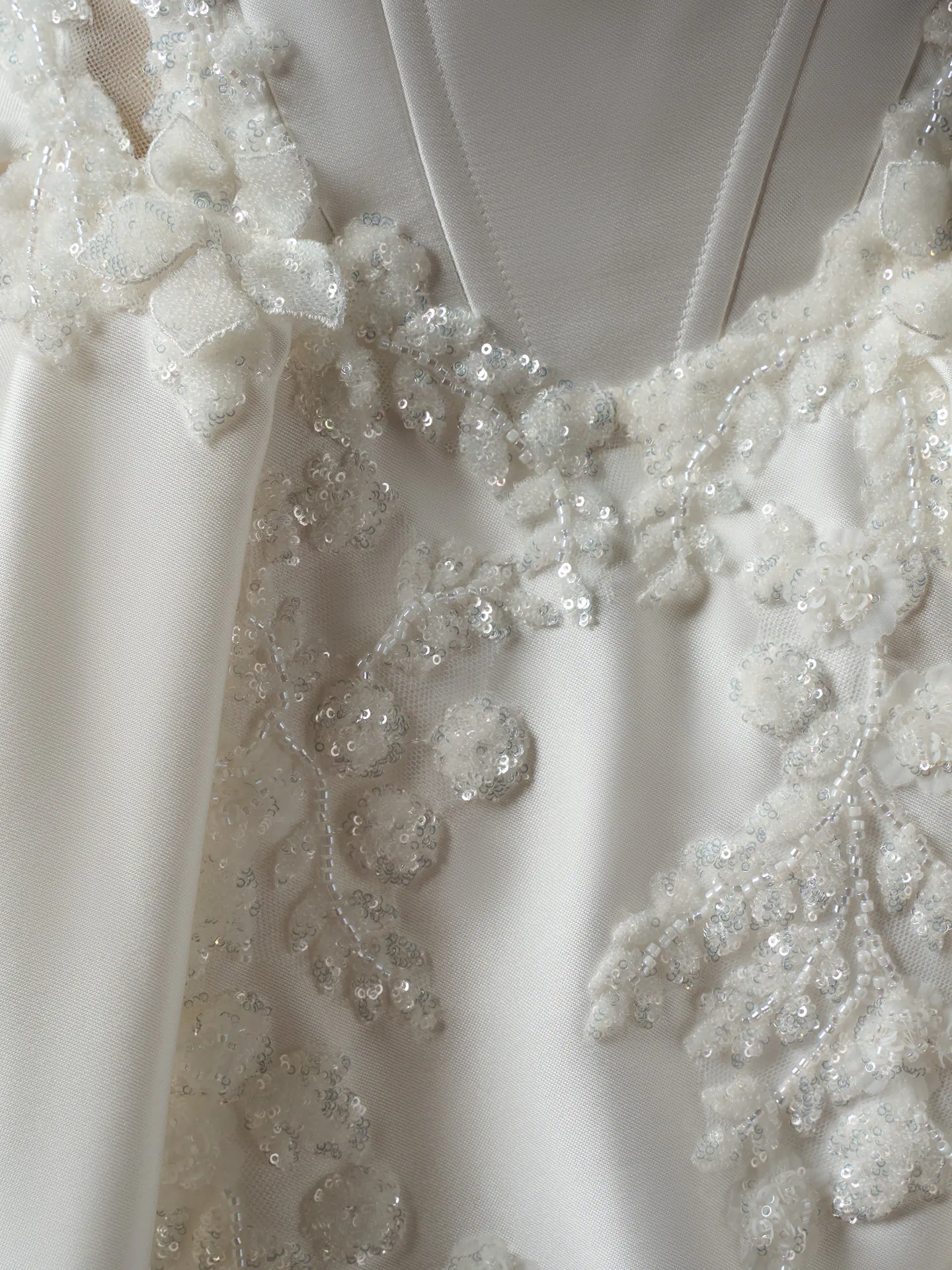 Sottero and Midgley Burke Lane detail with beaded lace on fabric.