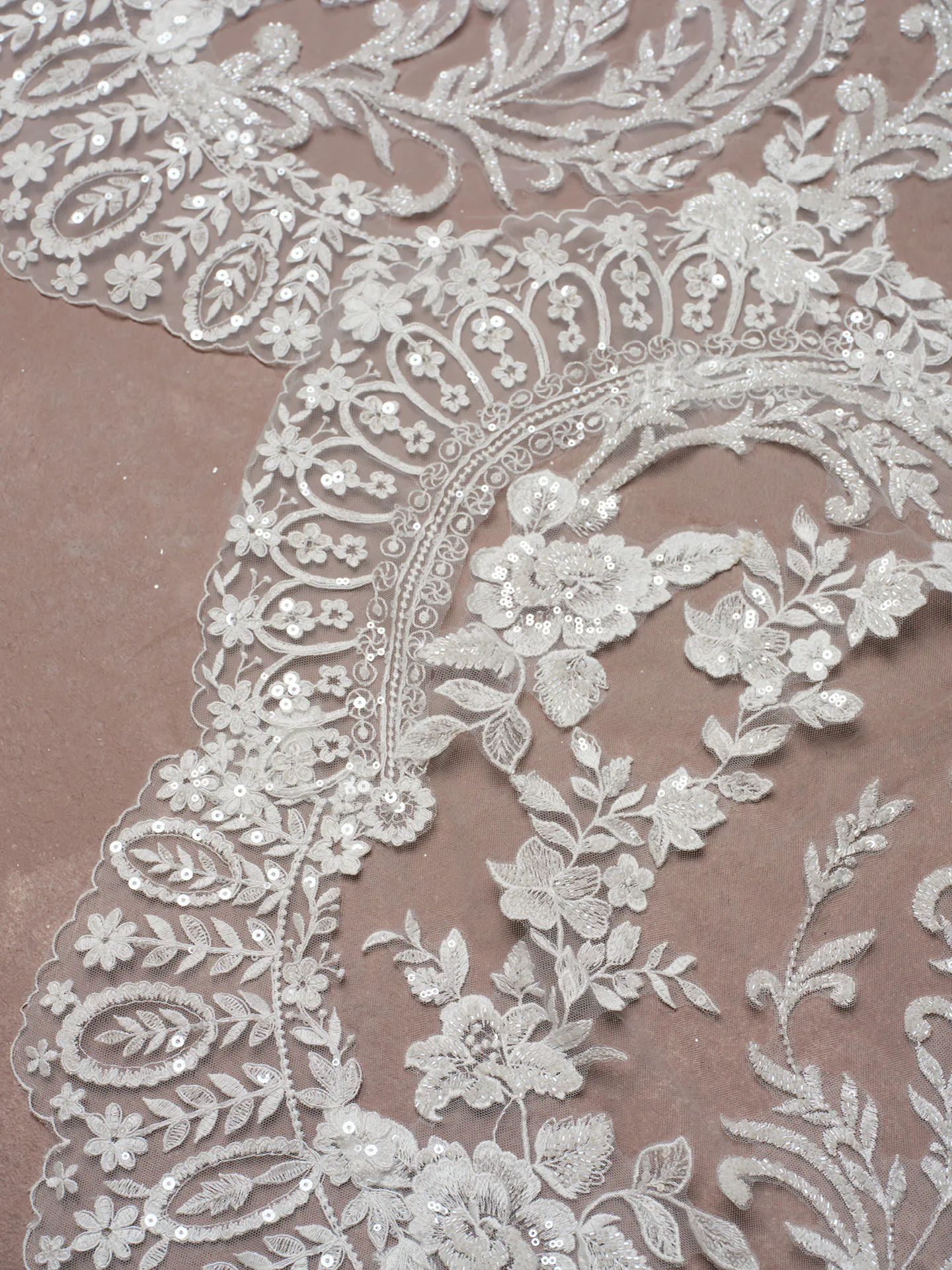 Sottero and Midgley Eirawen lace detail, floral embellishments on fabric.