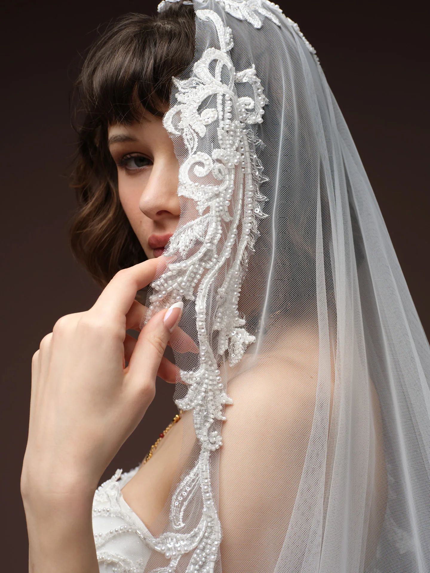 Sottero and Midgley Gwyneth veil detail with lace embroidery close-up.