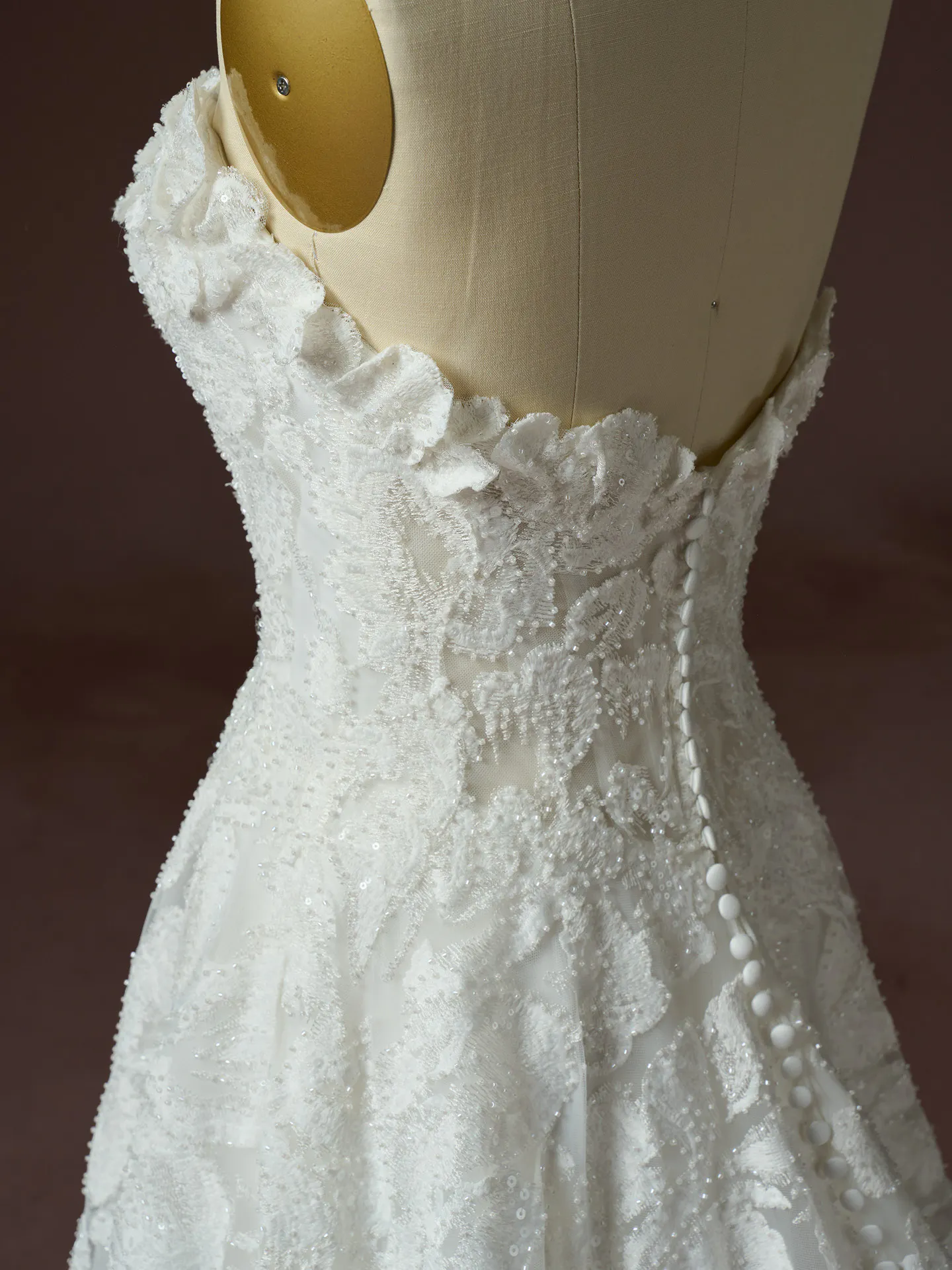 Sottero and Midgley Merrigan, back view beaded lace A-Line wedding dress detail white mannequin.