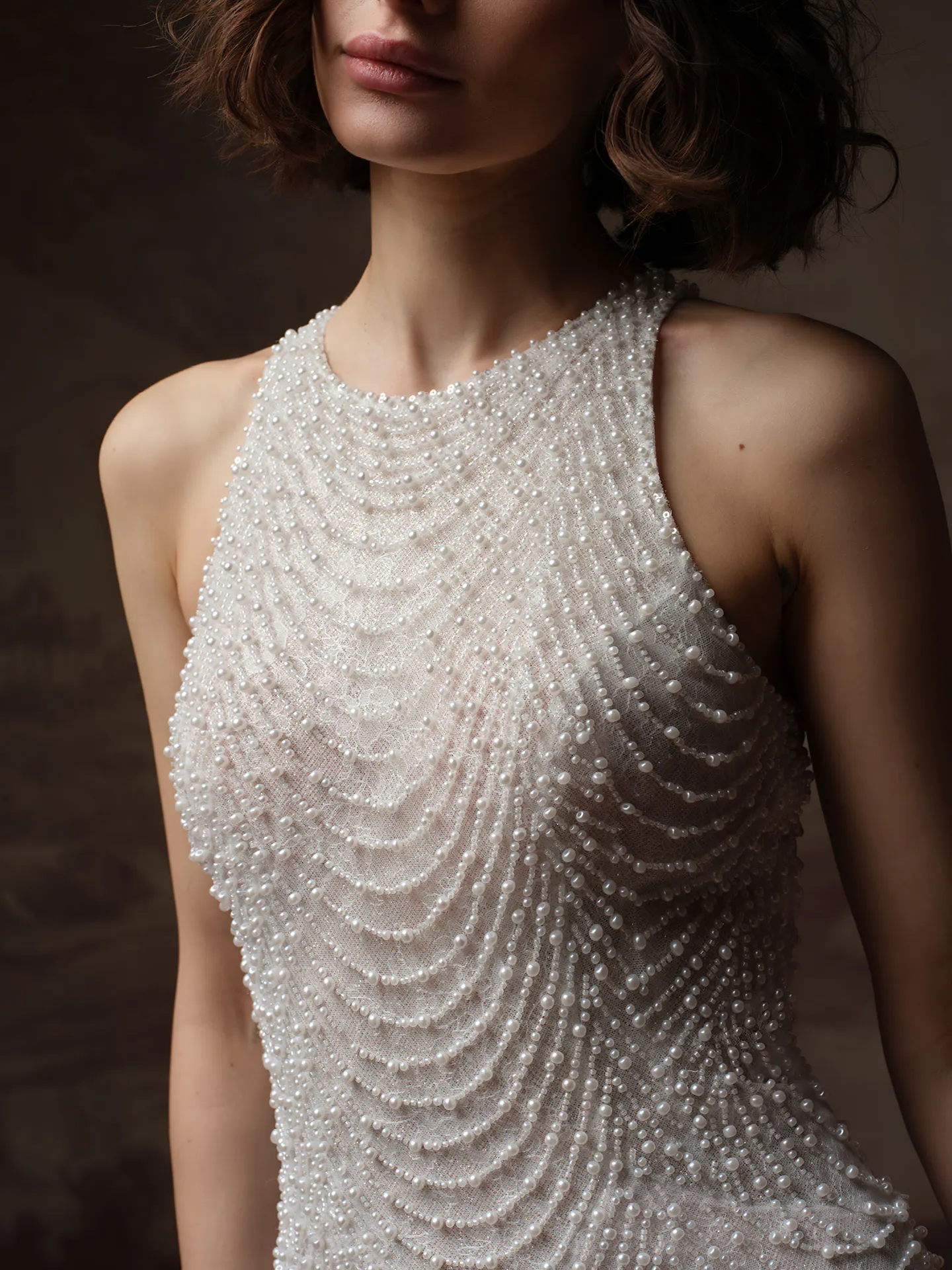 Sottero and Midgley Oleta, front view with intricate pearl lace detail.
