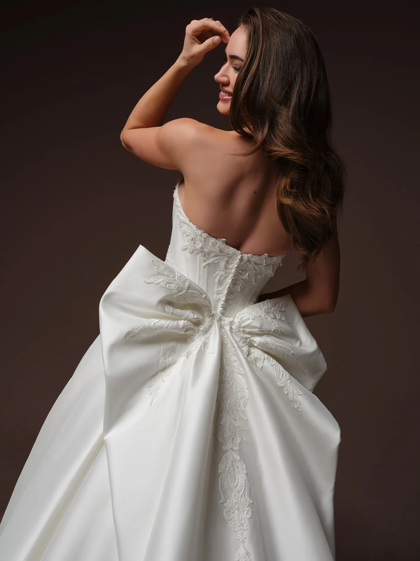 Sottero and Midgley Sandrine, back view with large lace bow.