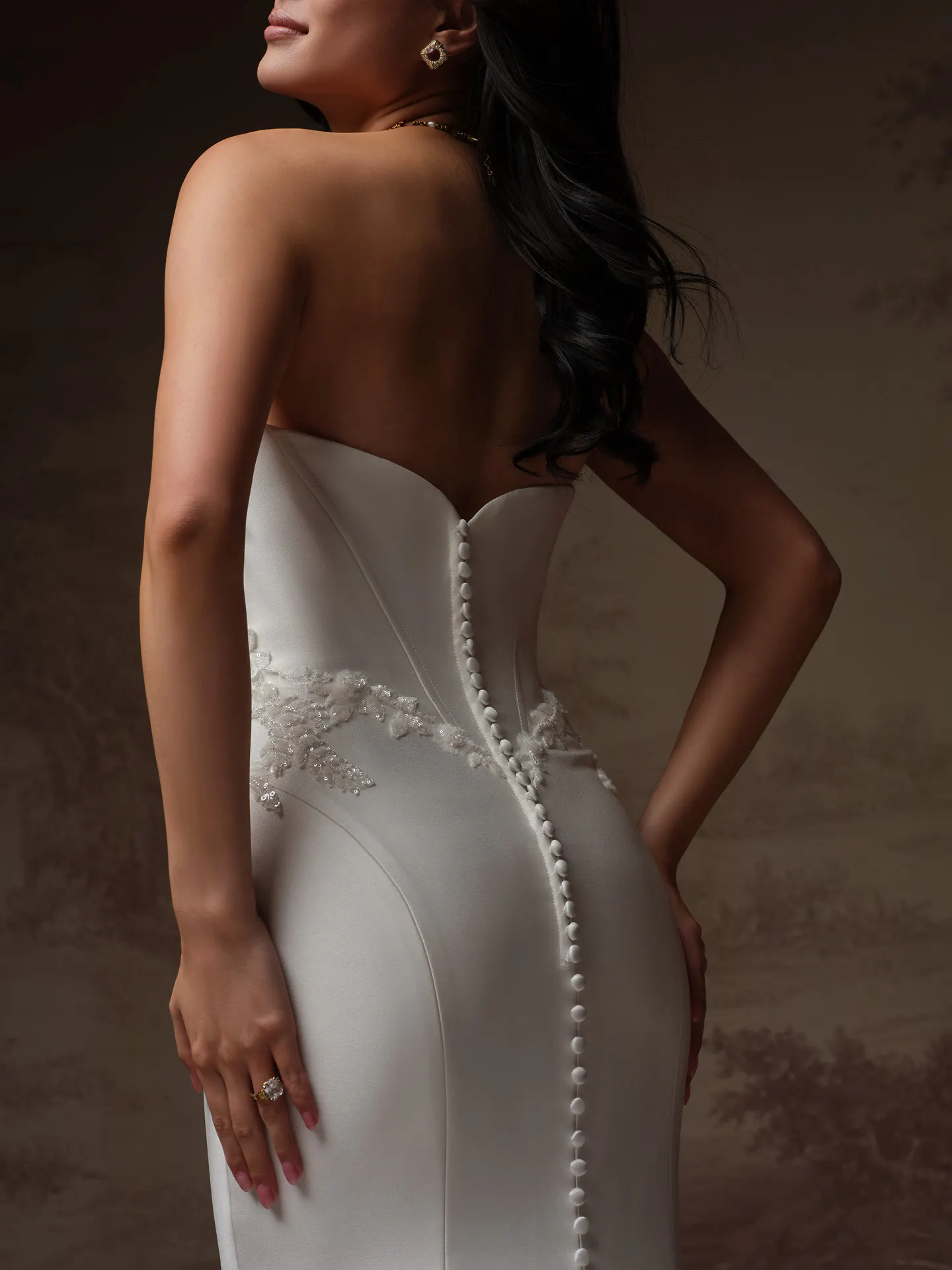 Sottero and Midgley Yadira, back view satin fit-and-flare wedding dress with bead details.