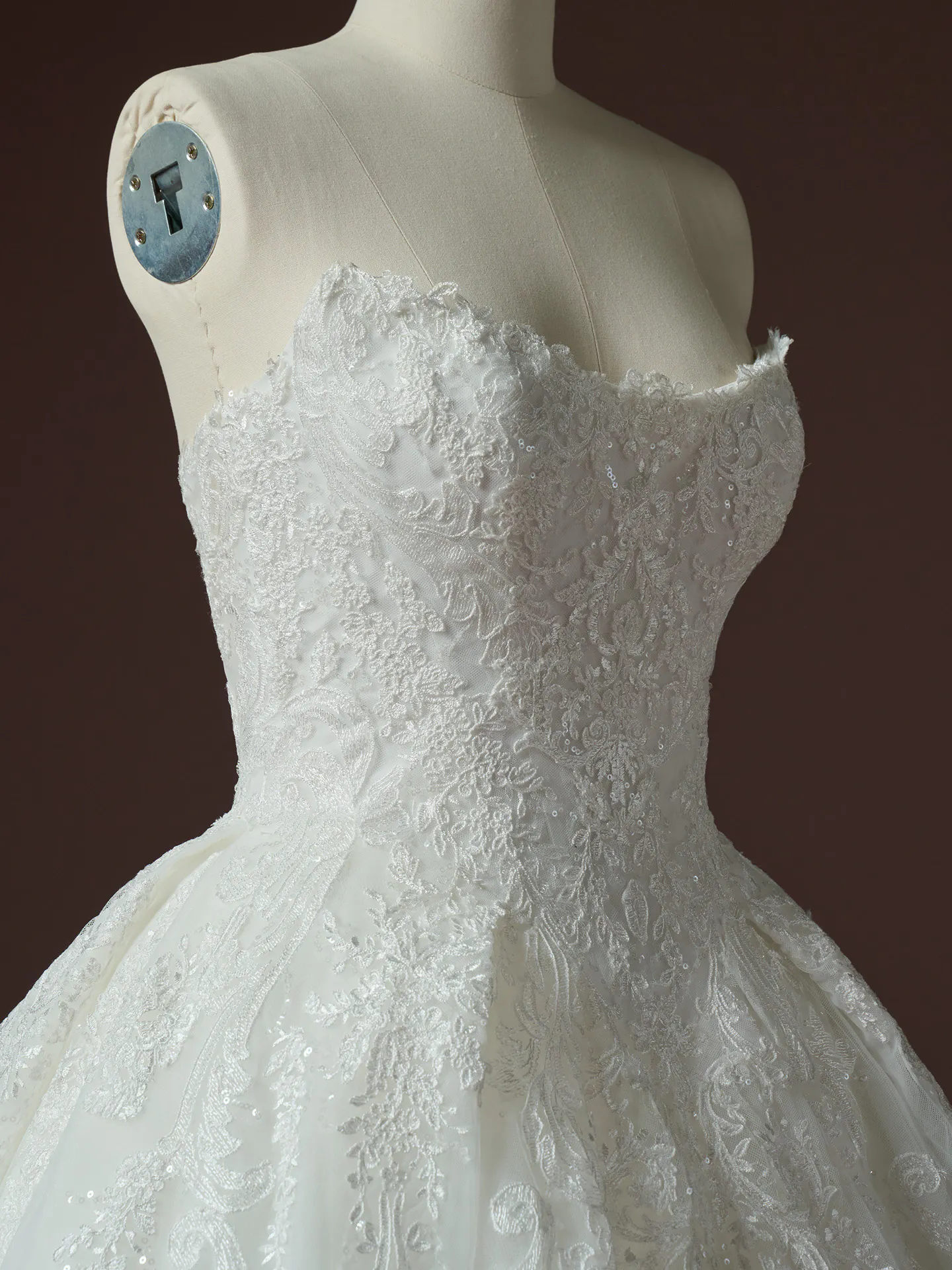 Sottero and Midgley Yesenia sequin lace ballgown bodice close-up on mannequin.