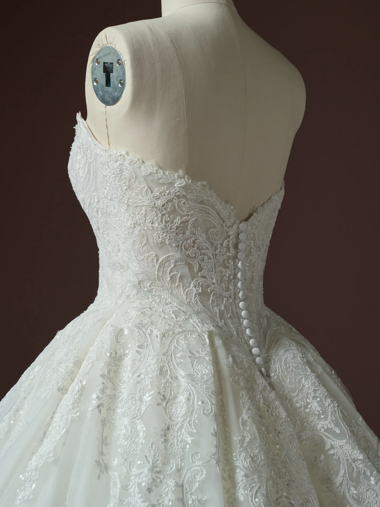 Sottero and Midgley Yesenia sequin lace ballgown, back view with button detail and elegant embroidery.