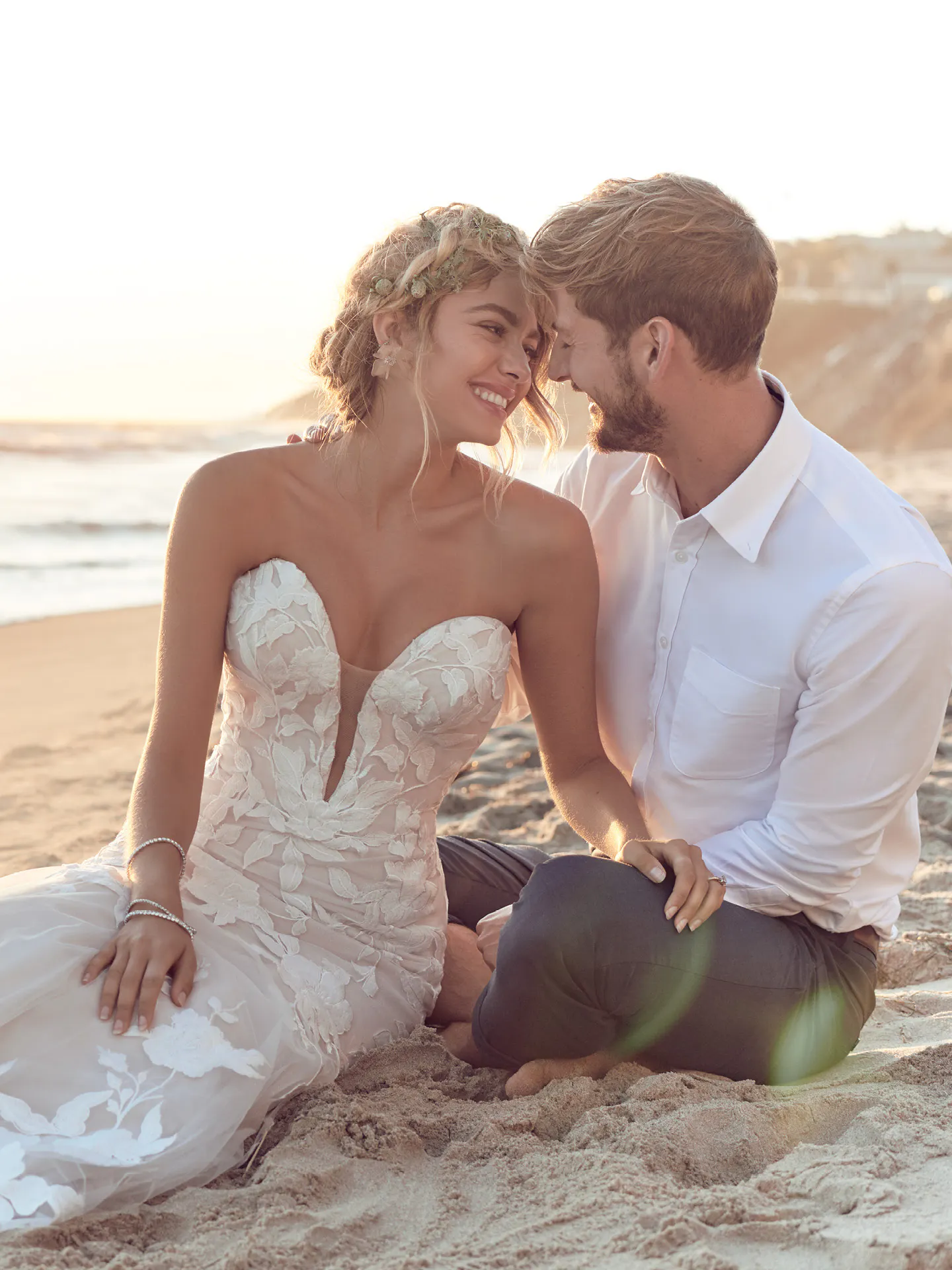 Rebecca Ingram Hattie strapless mermaid lace gown front view on beach